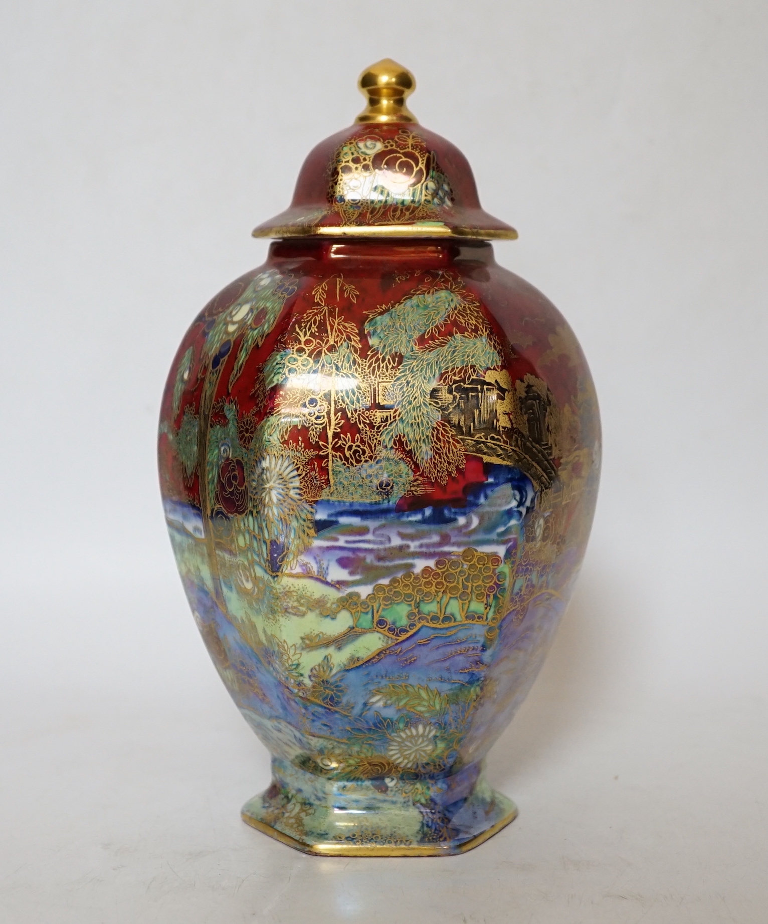 A Wilton ware lustre hexagonal lidded vase, numbered and stickered to underside A.G. Harley Jones, 23.5cm